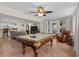 Entertaining game room featuring billiards table, leather chair, and tile flooring at 8000 13Th S Ave, St Petersburg, FL 33707