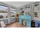 Bright office space with a vintage desk, chair, and natural light from multiple windows at 8000 13Th S Ave, St Petersburg, FL 33707
