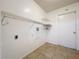 Small laundry room with wire shelving and tile flooring at 808 Smith Bay Dr, Brandon, FL 33510