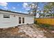 Backyard view of exterior and brick paver patio and a newly installed wooden fence at 8930 94Th Ave, Seminole, FL 33777