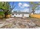 Backyard view of exterior and brick paver patio and a newly installed wooden fence at 8930 94Th Ave, Seminole, FL 33777