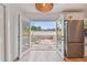 View from inside to the backyard through open glass doors at 8930 94Th Ave, Seminole, FL 33777