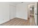 Bright bedroom with hardwood floors, closet, and ensuite bathroom at 8930 94Th Ave, Seminole, FL 33777
