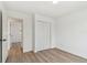 Bedroom with hardwood floors and closet at 8930 94Th Ave, Seminole, FL 33777