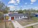 Inviting single-story home with an attached garage and a well-maintained lawn and an open front yard at 8930 94Th Ave, Seminole, FL 33777