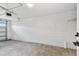 Unfinished garage with cinder block walls and overhead door at 8930 94Th Ave, Seminole, FL 33777