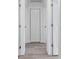 Hallway view showing recessed lights, closet, and doors at 8930 94Th Ave, Seminole, FL 33777