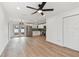 Open concept living area with kitchen featuring stainless steel appliances and French doors at 8930 94Th Ave, Seminole, FL 33777