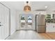 Open kitchen featuring stainless steel appliances and french doors to the backyard at 8930 94Th Ave, Seminole, FL 33777