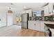 Updated kitchen features stainless steel appliances, white cabinets, and subway tile backsplash at 8930 94Th Ave, Seminole, FL 33777