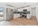 Updated kitchen features stainless steel appliances, white cabinets, and subway tile backsplash at 8930 94Th Ave, Seminole, FL 33777