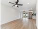 Bright living room with new flooring and a view into the kitchen at 8930 94Th Ave, Seminole, FL 33777
