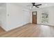 Spacious living room features wood flooring, large windows, and modern light fixtures at 8930 94Th Ave, Seminole, FL 33777