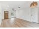 Bright, airy living room with new flooring and modern light fixture at 8930 94Th Ave, Seminole, FL 33777