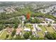 Serene aerial view of a charming neighborhood with a tranquil pond surrounded by lush greenery at 9811 Memorial Hwy, Tampa, FL 33615