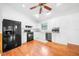 Charming kitchen with white cabinets, stainless steel appliances, and hardwood floors at 9811 Memorial Hwy, Tampa, FL 33615