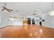 Spacious kitchen with black appliances, white cabinets, and hardwood floors at 9811 Memorial Hwy, Tampa, FL 33615