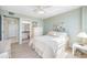 This well-lit bedroom includes a view into an ensuite bathroom at 10355 Paradise Blvd # 614, Treasure Island, FL 33706