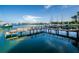 Picturesque dock with boats and a serene waterfront view, perfect for a relaxing day on the water at 10355 Paradise Blvd # 614, Treasure Island, FL 33706