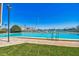Community pool overlooking boats docked at the waterfront at 10355 Paradise Blvd # 614, Treasure Island, FL 33706