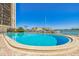 Community pool overlooking boats docked at the waterfront at 10355 Paradise Blvd # 614, Treasure Island, FL 33706
