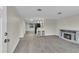 Inviting living room featuring gray tile floors, fireplace, and an open layout at 10837 Inglewood Ave, Port Richey, FL 34668