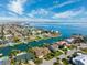 Lovely aerial view of waterfront homes with easy access to the open bay and beautiful blue skies at 123 12Th E St, Tierra Verde, FL 33715