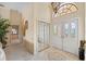 Inviting foyer with high ceilings, decorative flooring, and beautiful mirrored closet at 123 12Th E St, Tierra Verde, FL 33715