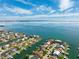 Coastal aerial showcasing waterfront homes with canal access, offering stunning views of the bay at 123 12Th E St, Tierra Verde, FL 33715