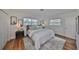 Bedroom features a comfortable bed, light colors and bright natural light at 1364 S Evergreen Ave, Clearwater, FL 33756