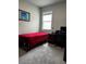 Bedroom includes a desk, accent art, and a comfortable space to relax and unwind at 1556 N River Cir, Tarpon Springs, FL 34689