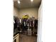 Walk-in closet with clothing racks and ample storage space, ideal for organizing apparel at 1556 N River Cir, Tarpon Springs, FL 34689