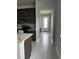 View of a stylish kitchen with granite countertops, dark wood cabinetry, and stainless steel appliances at 1556 N River Cir, Tarpon Springs, FL 34689