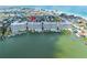 Stunning aerial view of waterfront condos with private boat slips, pool, and beach access in a desirable location at 17735 Gulf Blvd # 204, Redington Shores, FL 33708