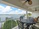 Balcony features a patio table with seating and a panoramic view of the marina at 17735 Gulf Blvd # 204, Redington Shores, FL 33708