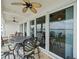 Balcony featuring outdoor seating and expansive sliding doors, perfect for entertaining at 17735 Gulf Blvd # 204, Redington Shores, FL 33708