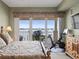 This bedroom features a water view, an exercise bike, and a large dresser at 17735 Gulf Blvd # 204, Redington Shores, FL 33708