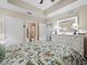 Bedroom boasts a large white dresser, and connects to a bathroom, creating a private suite at 17735 Gulf Blvd # 204, Redington Shores, FL 33708