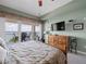 This bedroom features a water view, an exercise bike, and a flat screen television at 17735 Gulf Blvd # 204, Redington Shores, FL 33708