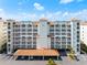 Stunning beachfront building featuring private balconies, covered parking, and beautiful architectural detailing at 17735 Gulf Blvd # 204, Redington Shores, FL 33708