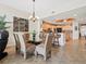 Open concept dining room with views to kitchen and table with seating for six at 17735 Gulf Blvd # 204, Redington Shores, FL 33708