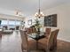Open floor plan with dining table and chairs, connecting living and dining areas with water views at 17735 Gulf Blvd # 204, Redington Shores, FL 33708