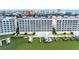 Beautiful waterfront condo building with boat docks, a swimming pool, and private balconies overlooking the water at 17735 Gulf Blvd # 204, Redington Shores, FL 33708