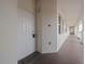 Inviting unit entrance featuring a white front door and welcome mat, promoting a cozy and welcoming space at 17735 Gulf Blvd # 204, Redington Shores, FL 33708