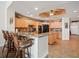 Open kitchen featuring granite countertops, wood cabinets, and modern appliances at 17735 Gulf Blvd # 204, Redington Shores, FL 33708
