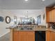 Open concept kitchen with granite countertops, under-cabinet lighting, and scenic views of the water, creating a serene cooking space at 17735 Gulf Blvd # 204, Redington Shores, FL 33708