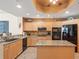 Well-equipped kitchen with granite counters, custom cabinetry, and modern appliances offer an inviting culinary space at 17735 Gulf Blvd # 204, Redington Shores, FL 33708