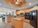 Stylish kitchen featuring granite countertops, stainless steel appliances, and a center island for additional prep space at 17735 Gulf Blvd # 204, Redington Shores, FL 33708