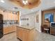 This bright open kitchen has granite countertops, custom cabinets and a center island creating a great workspace at 17735 Gulf Blvd # 204, Redington Shores, FL 33708