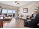 Cozy living room featuring a massage chair, comfortable seating, and water views at 17735 Gulf Blvd # 204, Redington Shores, FL 33708